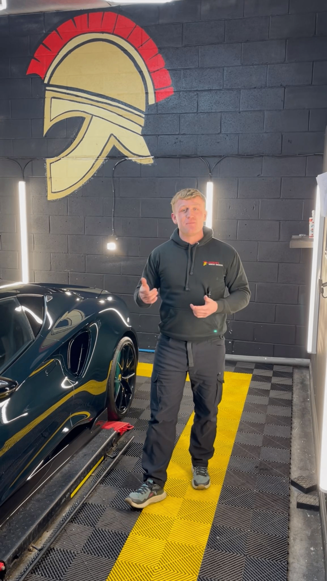 James, founder of Hadrian's Vehicle Services, in the detailing studio